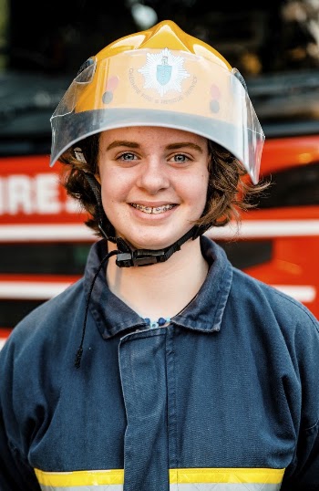 Smiling female firefighter, July 23, | Free Photo - rawpixel
