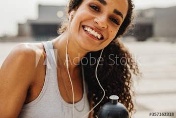 Smiling fitness woman outdoors