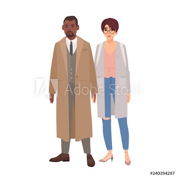 Smiling man and woman dressed in coats standing together