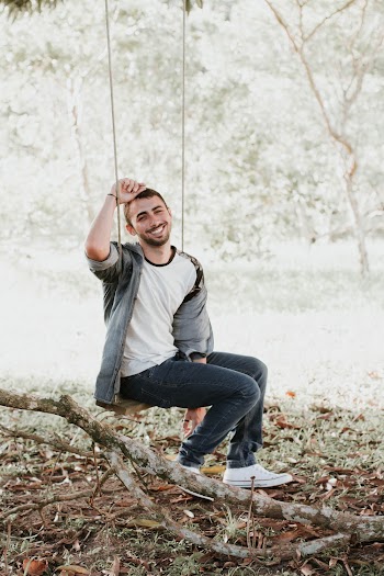 Smiling Man in Swing