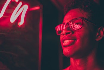 Smiling Man Wearing Black Framed Eyeglasses 