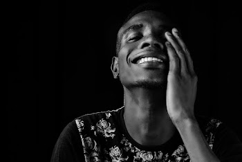 Smiling Man Wearing Floral Shirt