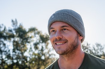 Smiling Man Wearing Gray Knit Cap