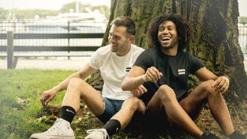 Smiling Men Sitting Beside Tree
