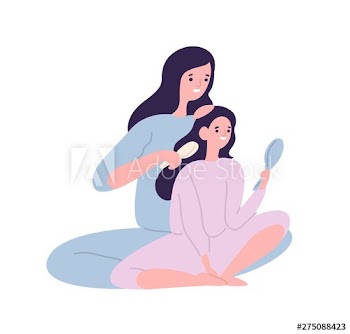 Smiling mother brushing hair of daughter with hairbrush