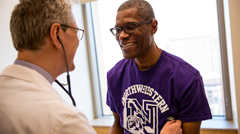 Smiling Patient in Cardiologist's Care