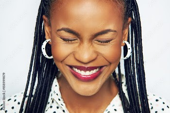 Smiling pretty black woman holding eyes closed
