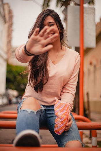 Smiling Woman Covering Her Face