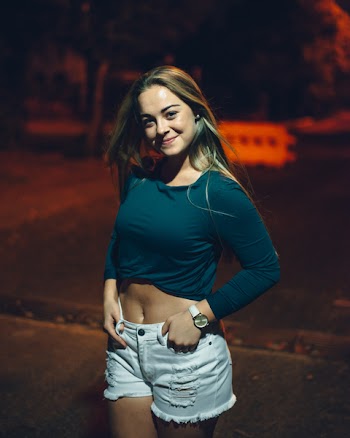 Smiling Woman during Night Time