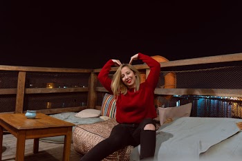 Smiling Woman Forming Heart Shape