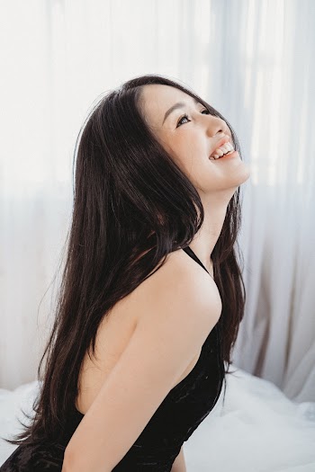 Smiling Woman in Black Halter Top
