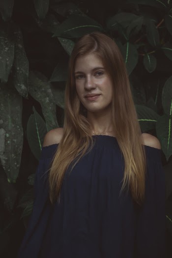 Smiling Woman in Black Off-shoulder Dress