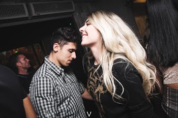 Smiling Woman in Front of Man