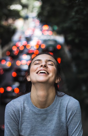 Smiling Woman in Gray Long-sleeved Shirt