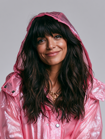 Smiling Woman in Pink Shiny Raincoat