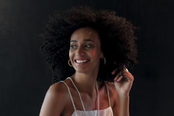 Smiling Woman in White Spaghetti Strap Top