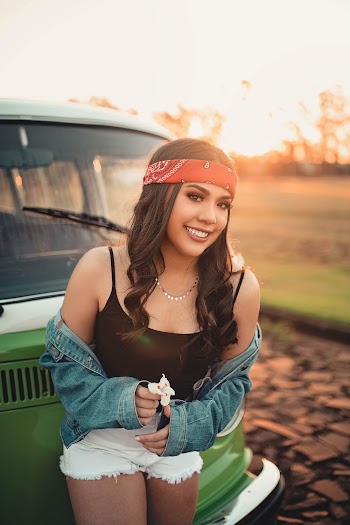 Smiling Woman Leaning on Car