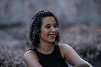 Smiling Woman Looking at Her Left