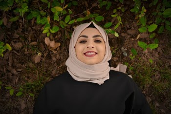 Smiling Woman Lying on Ground