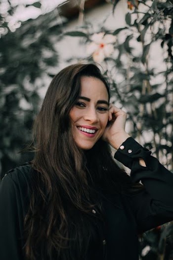 smiling woman near plants