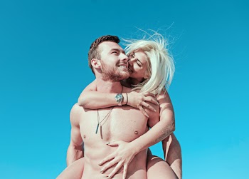 Smiling Woman Piggyback Riding Smiling Man