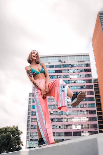 Smiling Woman Raising Her Foot