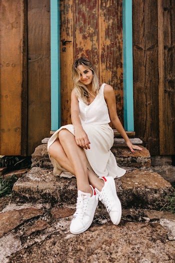 Smiling Woman Sitting By The Door