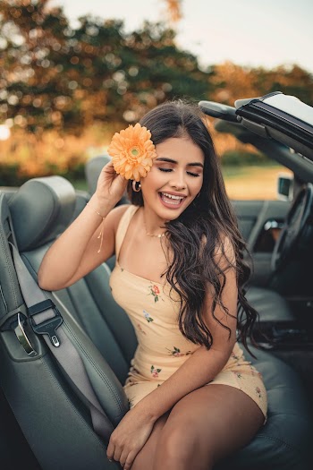 Smiling Woman Sitting Inside Car