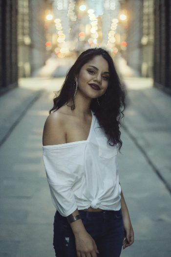 Smiling Woman Standing on Pathway