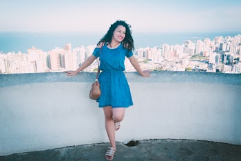 Smiling Woman Standing on Rooftop
