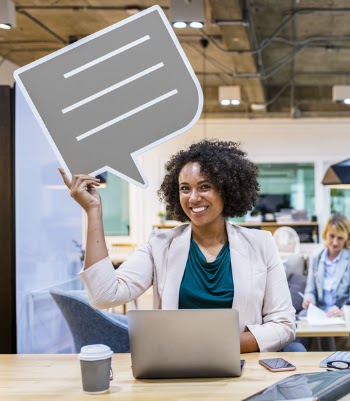 Smiling Woman Using Laptop Computer