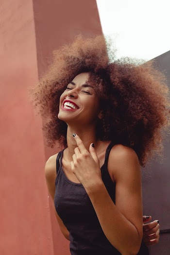 Smiling Woman Wearing Black Camisole 