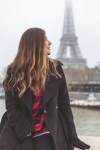 Smiling Woman Wearing Black Coat Back of Paris Eiffel Tower