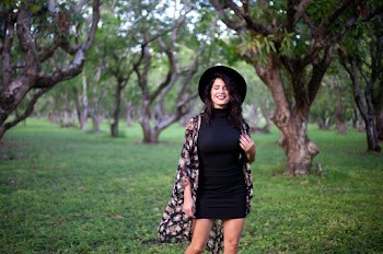 Smiling Woman Wearing Black Dres