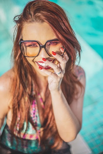 Smiling Woman Wearing Black Frame Eyeglasses
