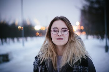 Smiling Woman Wearing Black Framed Eyeglasses Outdoor
