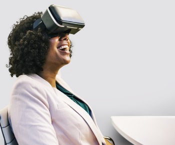 Smiling Woman Wearing Black Virtual Reality Headset