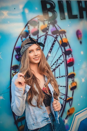 Smiling Woman Wearing Blue Denim Jacket