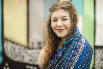 Smiling Woman Wearing Blue Top