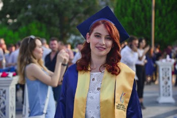 Smiling Woman Wearing Graduation Dress