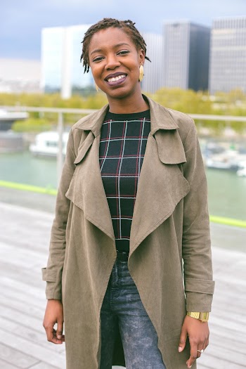 Smiling Woman Wearing Gray Coat