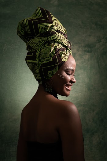 Smiling Woman Wearing Green and Black Turban