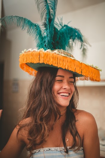 Smiling Woman Wearing Orange Hat