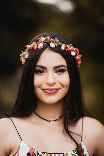 Smiling Woman Wearing Pink Flower Headband