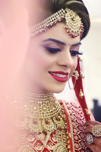 Smiling Woman Wearing Red and Gray Wedding Sari Dress