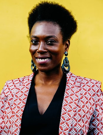 Smiling Woman Wearing Red and White Blazer