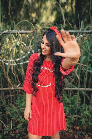 Smiling Woman Wearing Red Dress