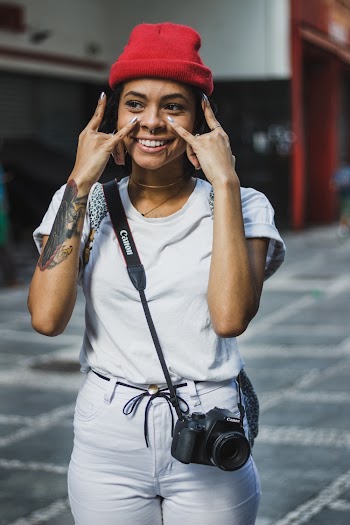 Smiling Woman Wearing Red Knit Cap