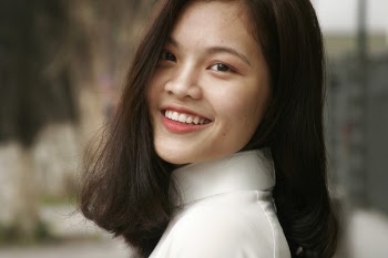 Smiling Woman Wearing White Turtleneck Top