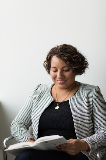 Smiling Woman While Reading Book